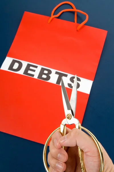 Torba na zakupy i słowo długów — Zdjęcie stockowe