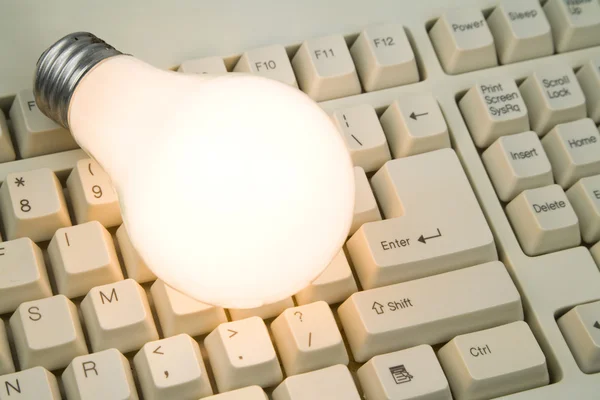 stock image Light Bulb and Computer Keyboard