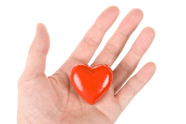 Kırmızı bir kalbi tutan el. — Stok fotoğraf