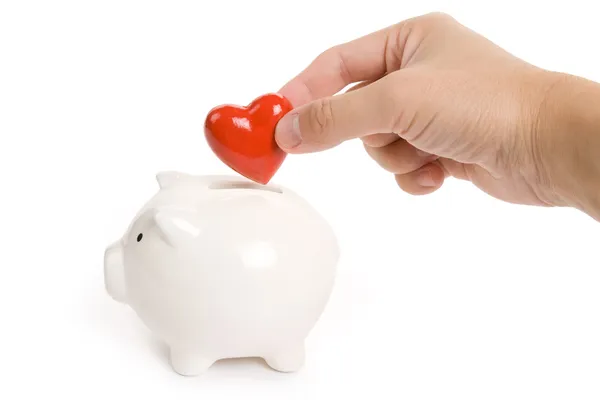 Banco Piggy e coração vermelho — Fotografia de Stock