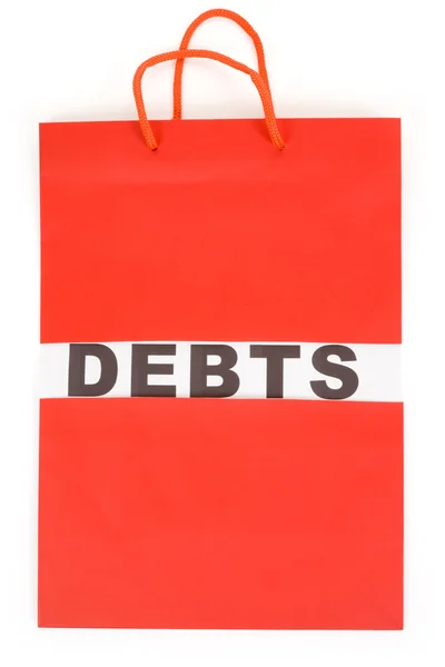 Torba na zakupy i słowo długów — Zdjęcie stockowe