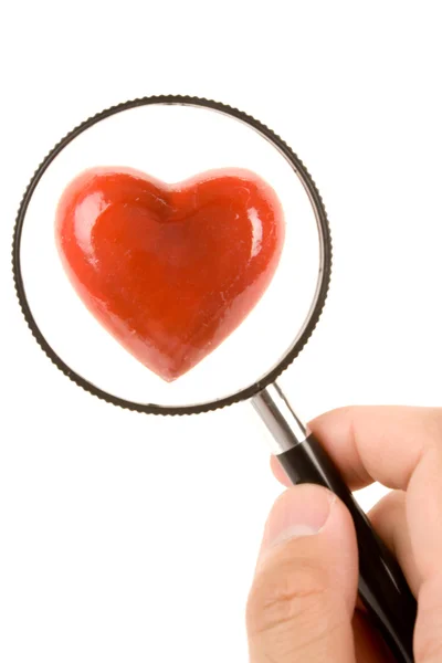 Red Heart and magnifier — Stock Photo, Image