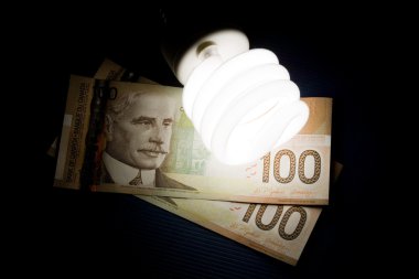 Compact Fluorescent Lightbulb and dollar clipart