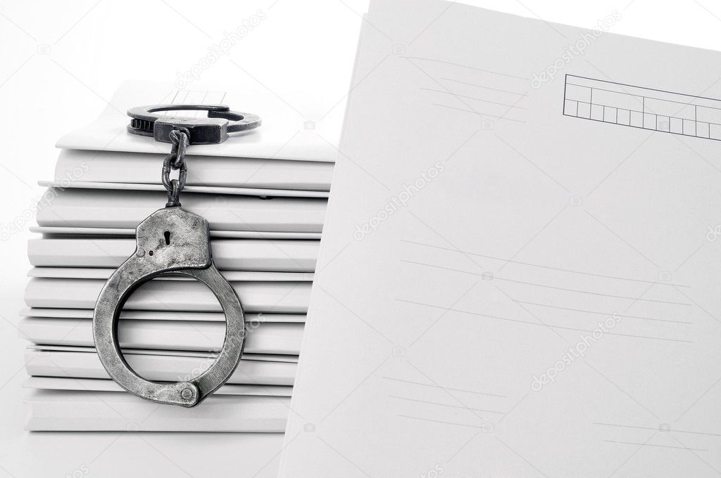 Old metal handcuffs and blank case file