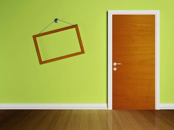 Door in the empty room and a frame — Stock Photo, Image