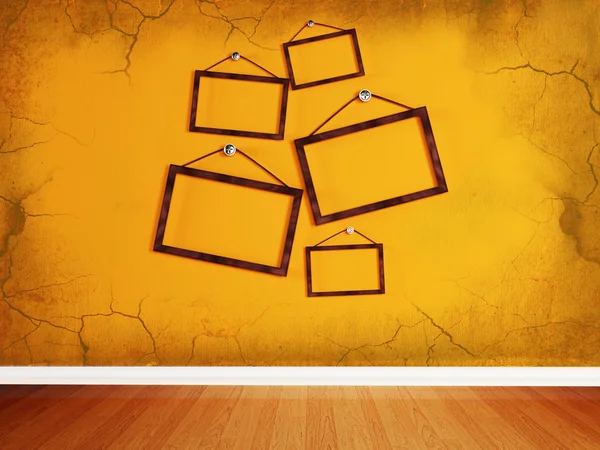 Wooden frames, randomly located on the wall — Stock Photo, Image