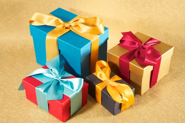 Four colour present boxes — Stock Photo, Image