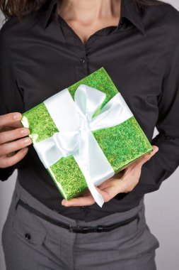 Green present on black background clipart