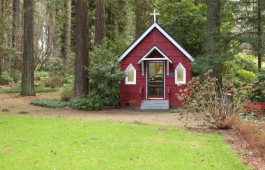 A small red chapel in a forest, Portland OR. clipart