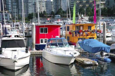 Boat houses in downtown Vancouver BC Canada. clipart