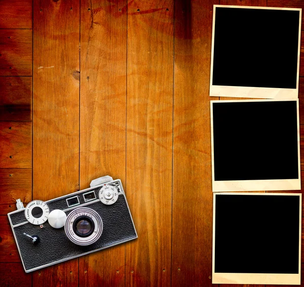 stock image Vintage Pictures and Camera on Wooden Old Table