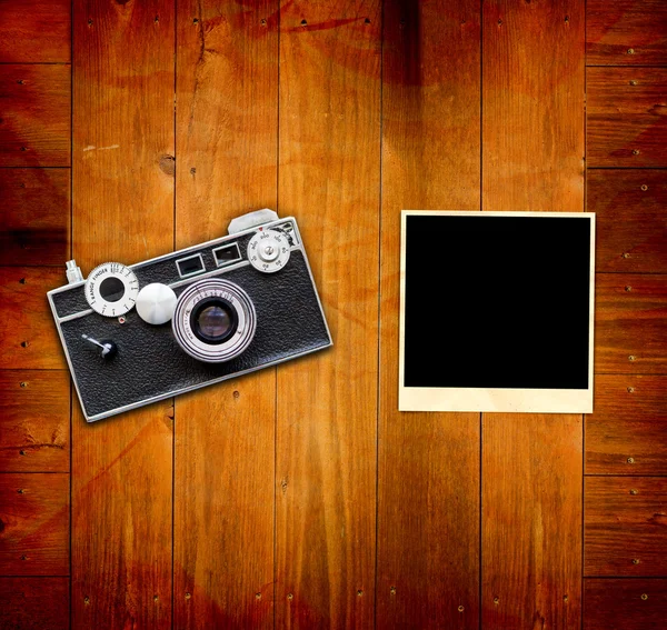 stock image Vintage Pictures and Camera on Wooden Old Table