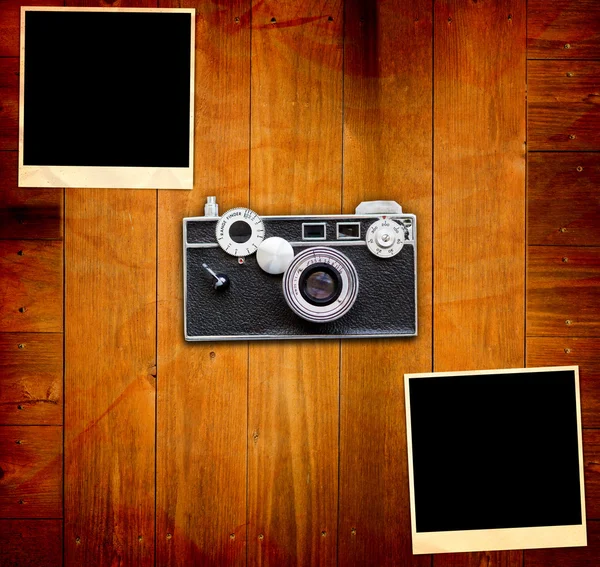 stock image Vintage Pictures and Camera on Wooden Old Table