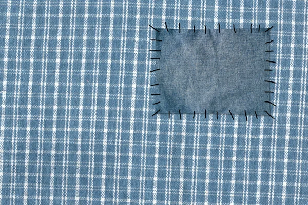 Фон - ткань, прикрепленная к джинсам — стоковое фото