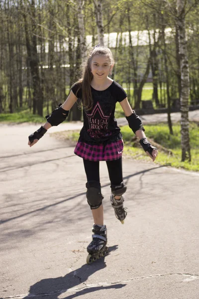 stock image Young girl skating on Roller Skates outdoor