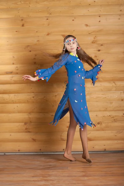 Girl dancing in blue dress — Stock Photo, Image