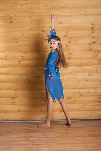 Girl dancing in blue dress — Stock Photo, Image