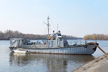 Motor ship at small river harbor