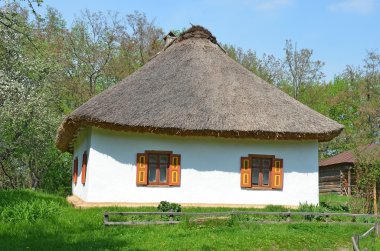 Ancient hut with a straw roof clipart