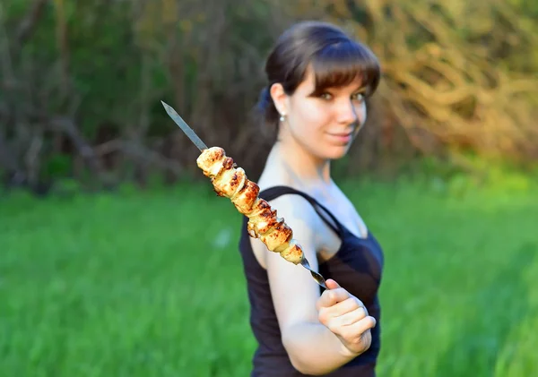 Woman with shish kebab — Stock Photo, Image