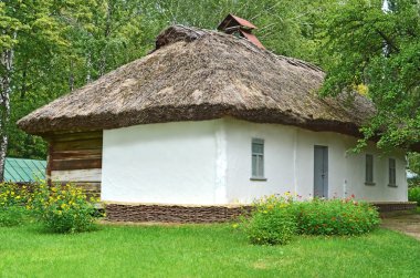 Ancient hut with a straw roof clipart