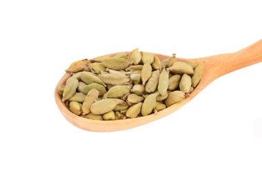 Cardamom pods in wooden spoon clipart