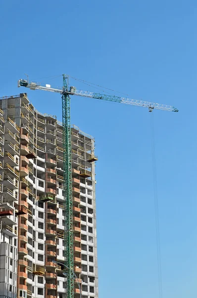 stock image Crane and highrise construction site