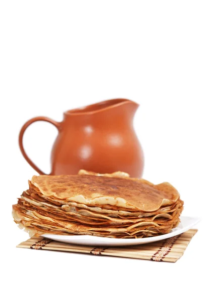 Pancakes and jug — Stock Photo, Image