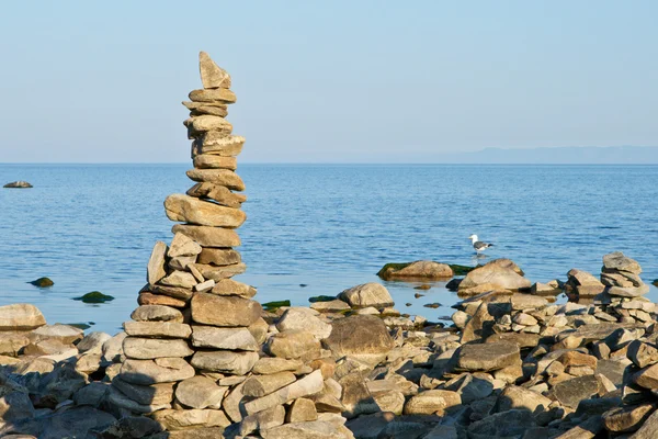 Stock image High pyramid from a stone on the bank of Baikal.