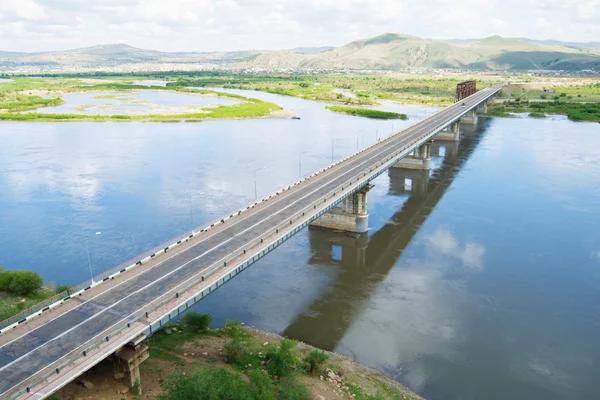 stock image The bridge through the river on two coast