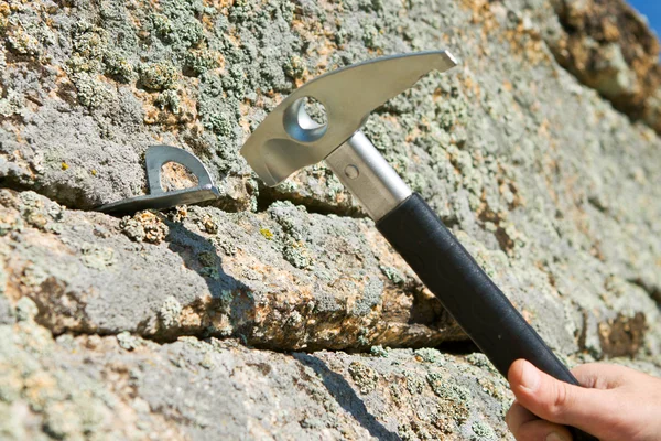 In hook hammer into crack of rock hammer — Stock Photo, Image