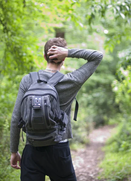 stock image A young person goes to a spring forest