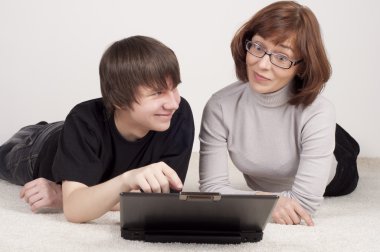 Mother and son are together, work with computer clipart