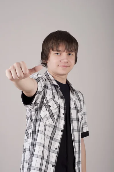 Portrait of teen boy, with trumbs up — Stock Photo, Image