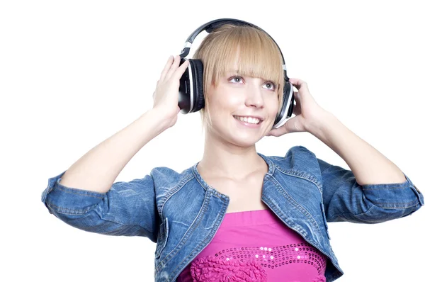 stock image Young attractive woman listing to music