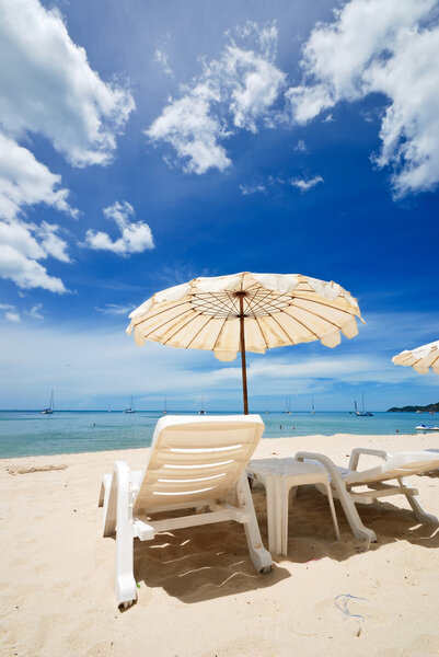 Very nice white beach umbrella at nice dark blue sky