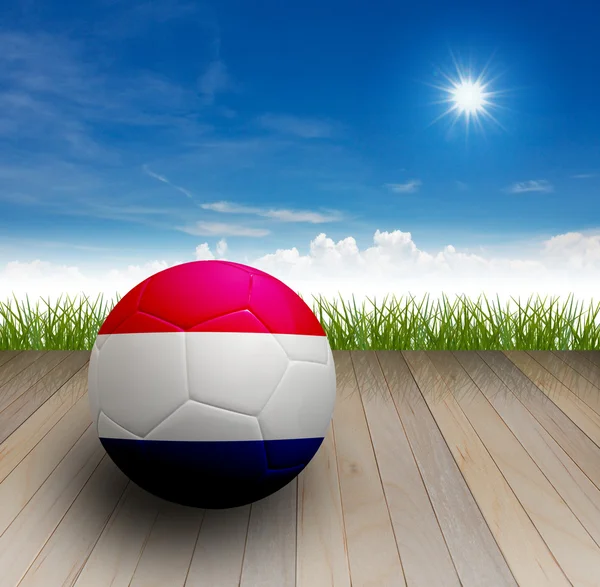 Piłka nożna na podłodze — Zdjęcie stockowe
