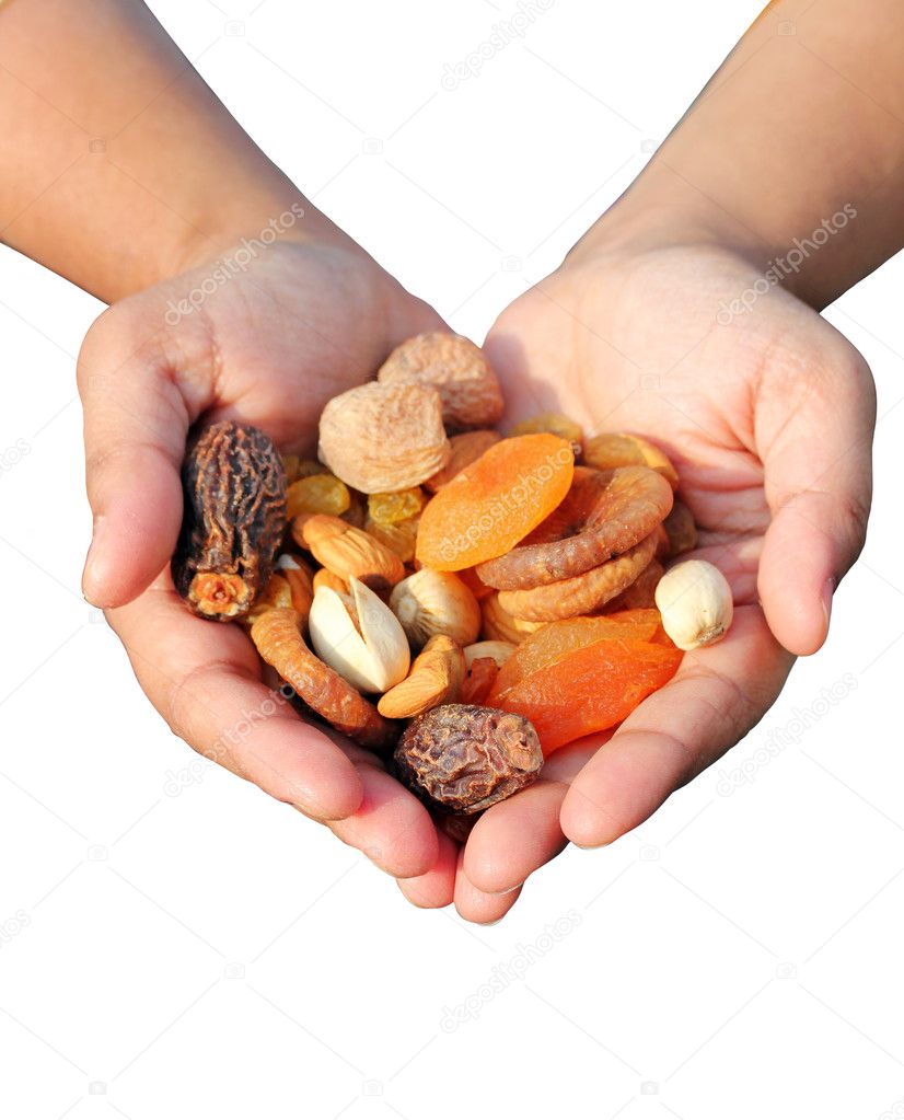 Woman holding bunch of dry fruits isolated on white