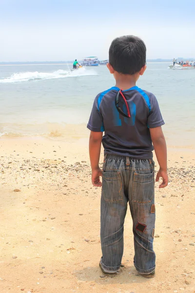 stock image Young kid standing and watching bike adventure