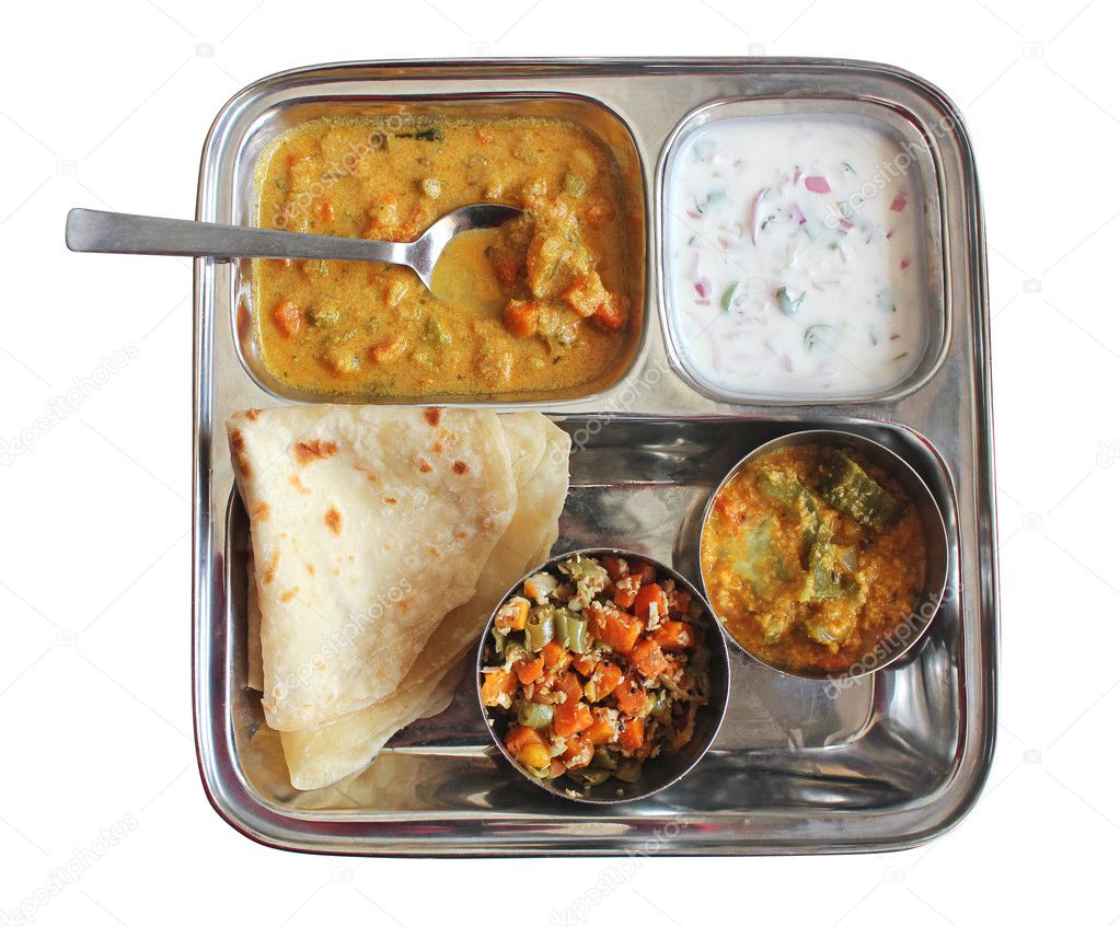 Traditional Indian bread chapati with curries, raitha