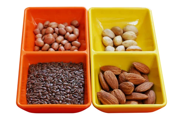 Dry seeds - almond, pistachio, peanut and flaxseed — Stock Photo, Image