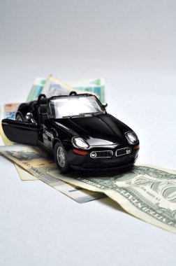 Black sport car and money clipart