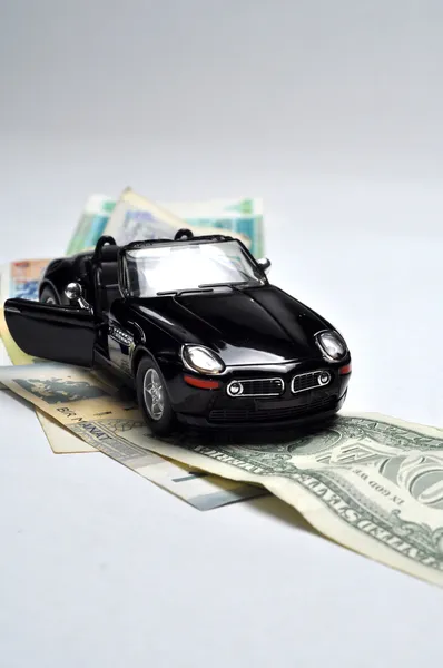 Black sport car and money