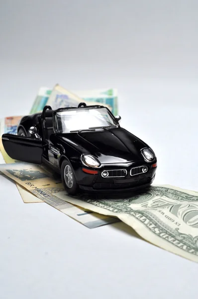 Чорний спортивний автомобіль і гроші Ліцензійні Стокові Фото