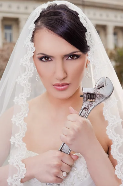 stock image Angry bride hodling wrench