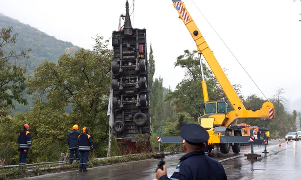 Stock image Crane lifting crashed truck