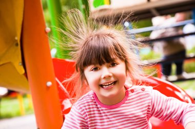 Happy girl static electricity clipart