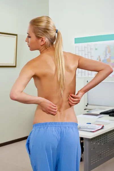 Topless female patient back pain — Stock Photo, Image