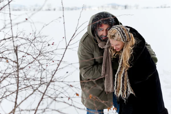 Winter field strugle couple — Stock Photo, Image