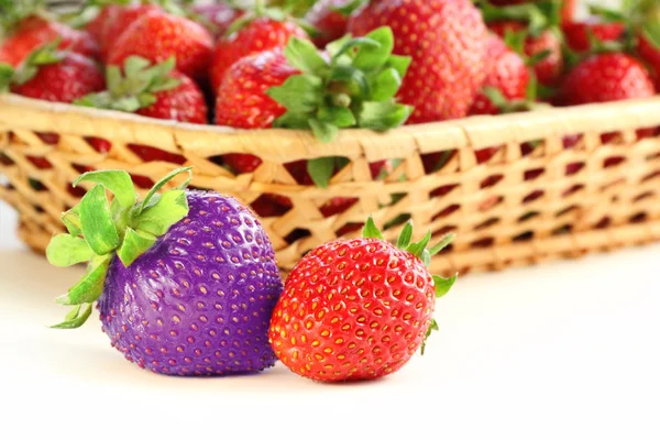 Red and blue strawberries — Stock Photo, Image